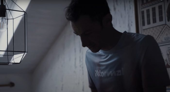 gazing downward in a shadowy room